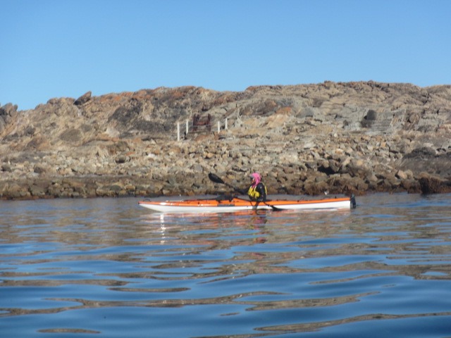 Robyn passes the remains of the old fishing sheds and launching winch 
